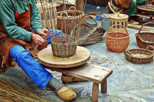 A man weaving a basket