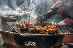 Meats on a barbecue.