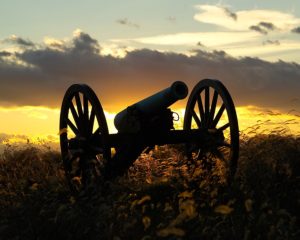 A Civil War cannon at sunset.